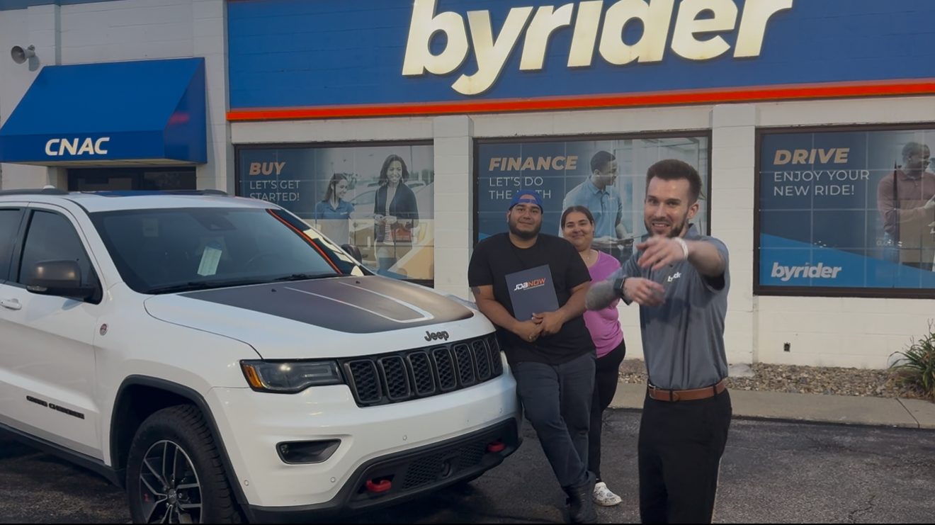 Byrider Amherst customers with their used Jeep Grand Cherokee at the Amherst, Ohio dealership